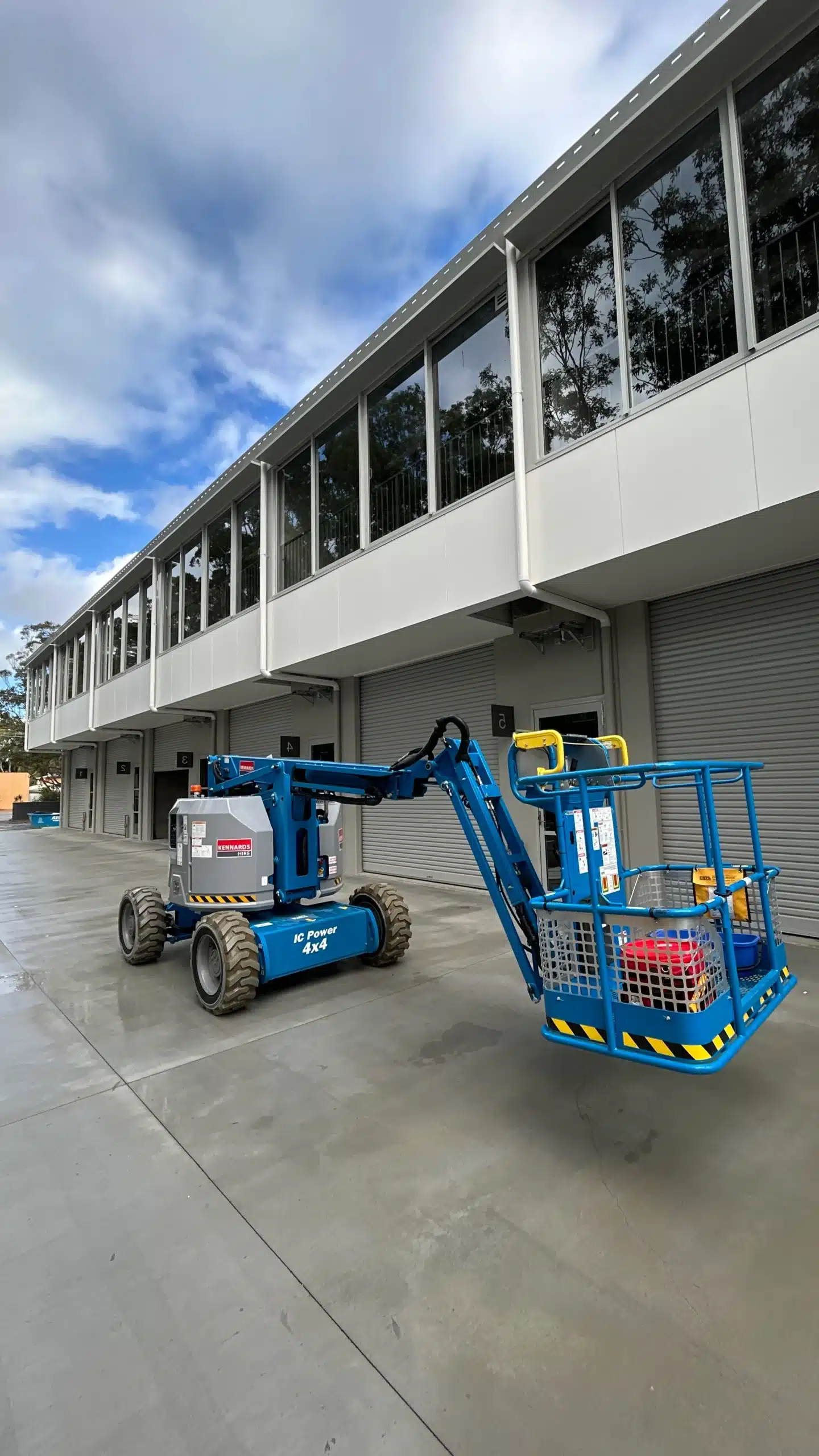 CleansePro high-level window cleaners using an elevated work platform on the Gold Coast